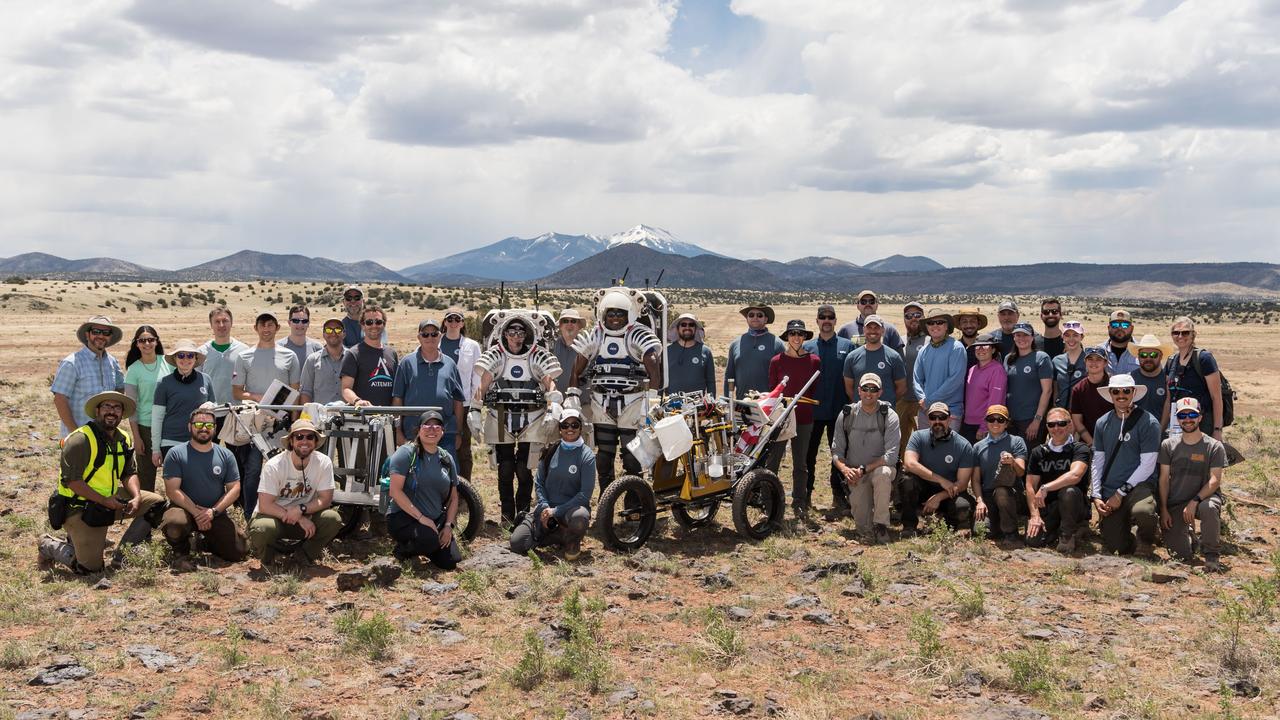 The Joint Extravehicular Activity and Human Surface Mobility Test Team and NASA astronauts Kate Rubins and Andre Douglas before the start of a week-long field test consisting of four simulated moonwalks and six advanced technology runs in the San Francisco Volcanic Field in Northern Arizona on May 13, 2024.   Credit: NASA/Josh Valcarcel 