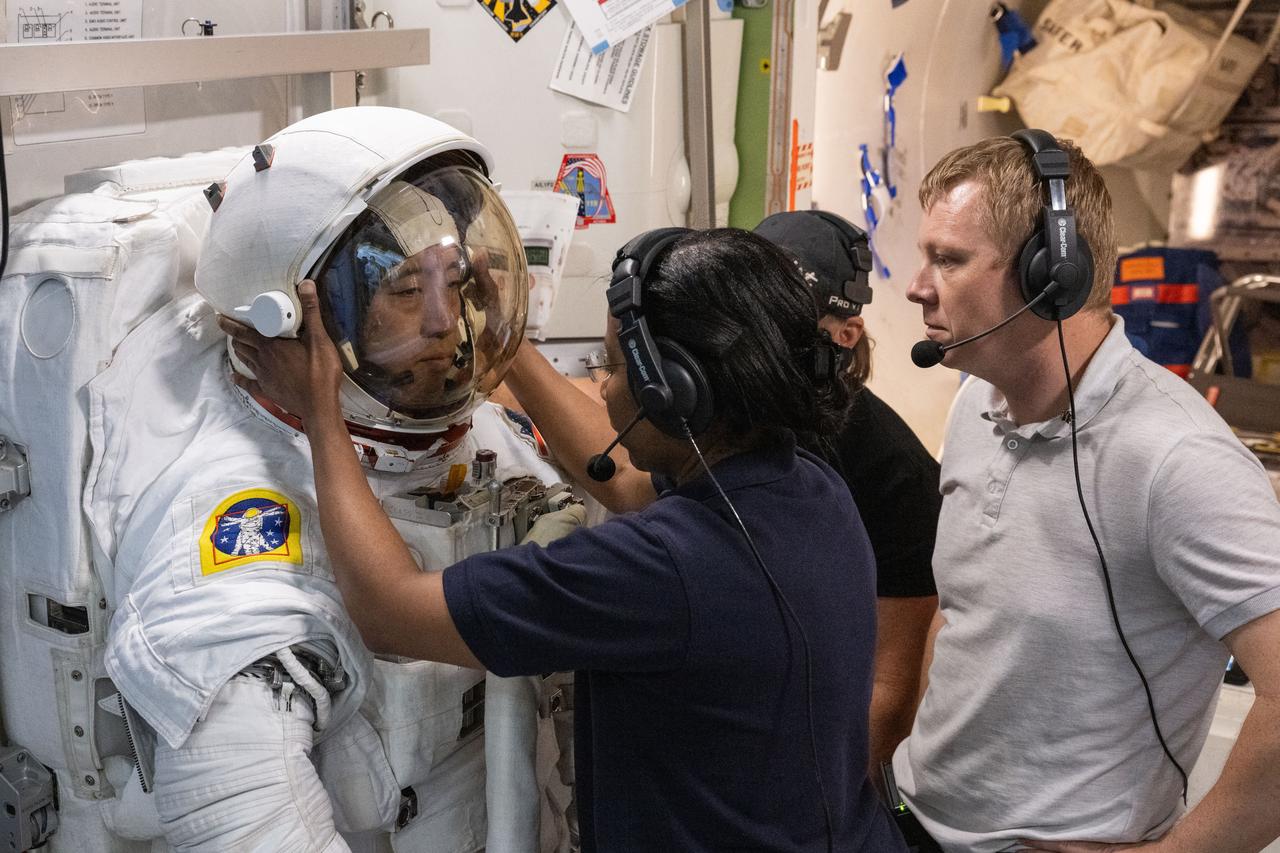jsc2024e035671 (May 17, 2024) --- NASA astronaut and Soyuz MS-27 crew member Jonny Kim completes spacewalk preparation training inside the International Space Station mockup at Johnson Space Center with astronauts Zena Cardman, Stephanie Wilson, and Nick Hague and cosmonaut Aleksandr Gorbunov.