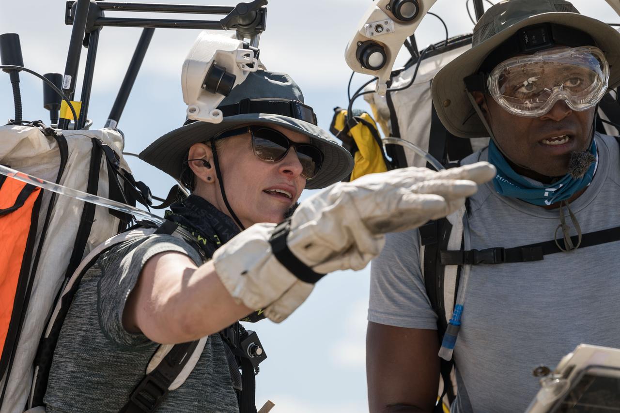 NASA astronauts Kate Rubins and Andre Douglas look ahead at their traverse during a simulated moonwalk in the San Francisco Volcanic Field in Northern Arizona on May 17, 2024. Credit: NASA/Josh Valcarcel 