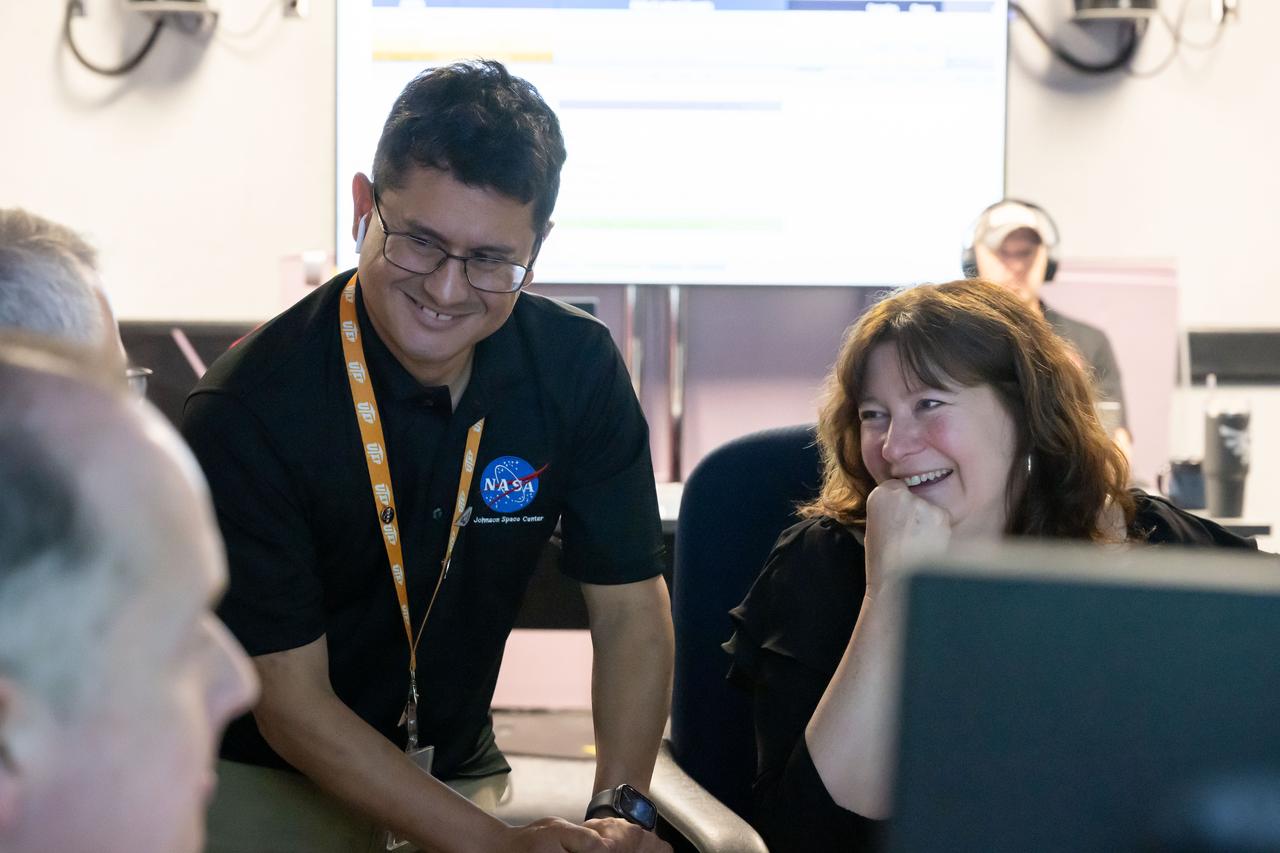 Artemis III Geology Team member, Jose Hurtado from the University of Texas at El Paso, left, and Maria Banks of NASA’s Goddard Spaceflight Center work in the Science Evaluation Room (SER) during the JETT 5 field test. JETT 5 was a week-long field test in the lunar-like landscape of San Francisco Volcanic Field near Flagstaff, Arizona while a team of flight controllers and scientists at Johnson monitor and guide their activities.  Credit: NASA/Helen Arase Vargas