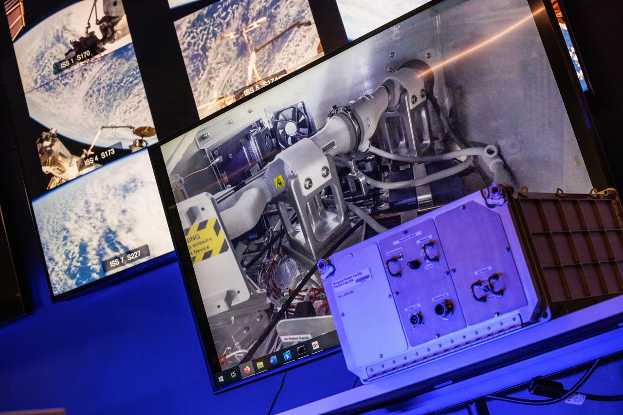 jsc2024e041211 (2/10/2024) --- Robotic Surgery Tech Demo tests techniques for performing robotic surgery in microgravity using a miniature surgical robot that can be remotely controlled or teleoperated from Earth. Several monitors at the Virtual Incision offices in Lincoln, Nebraska show views of the International Space Station during remote operations. Near the center, a larger monitor shows inside the box aboard the space station that houses the surgical robot. Results from this investigation could support the development of robotic systems to perform remote procedures. Miniaturization and the ability to remotely control robots may help to make surgery available anywhere and anytime. Image courtesy of the University of Nebraska-Lincoln.