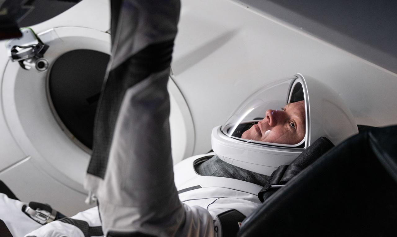 jsc2024e042501 (May 5, 2024) --- Roscosmos cosmonaut and SpaceX Crew-9 Mission Specialist Aleksandr Gorbunov focuses on training inside a Dragon mockup crew vehicle at the company's headquarters in Hawthorne, California. Credit: SpaceX