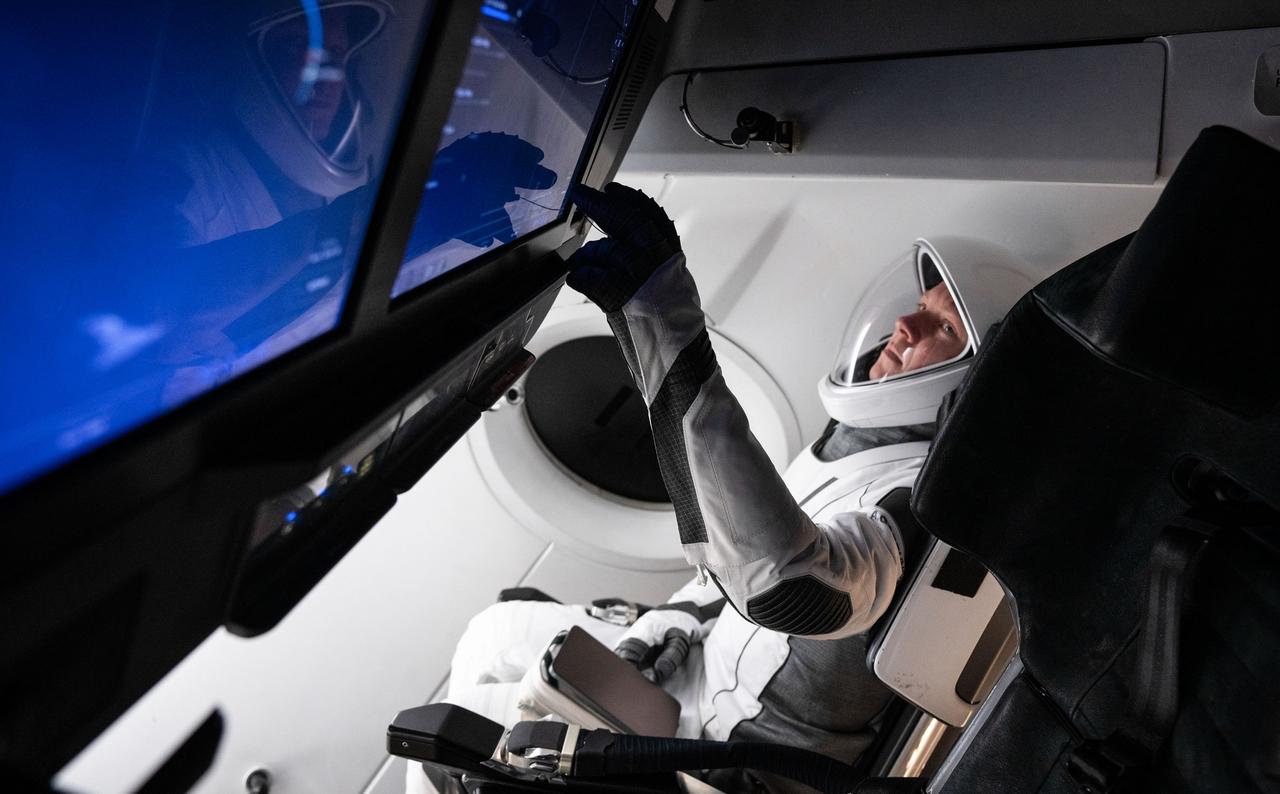 jsc2024e042502 (May 5, 2024) --- Roscosmos cosmonaut and SpaceX Crew-9 Mission Specialist Aleksandr Gorbunov is pictured training inside a Dragon mockup crew vehicle at the company's headquarters in Hawthorne, California. Credit: SpaceX