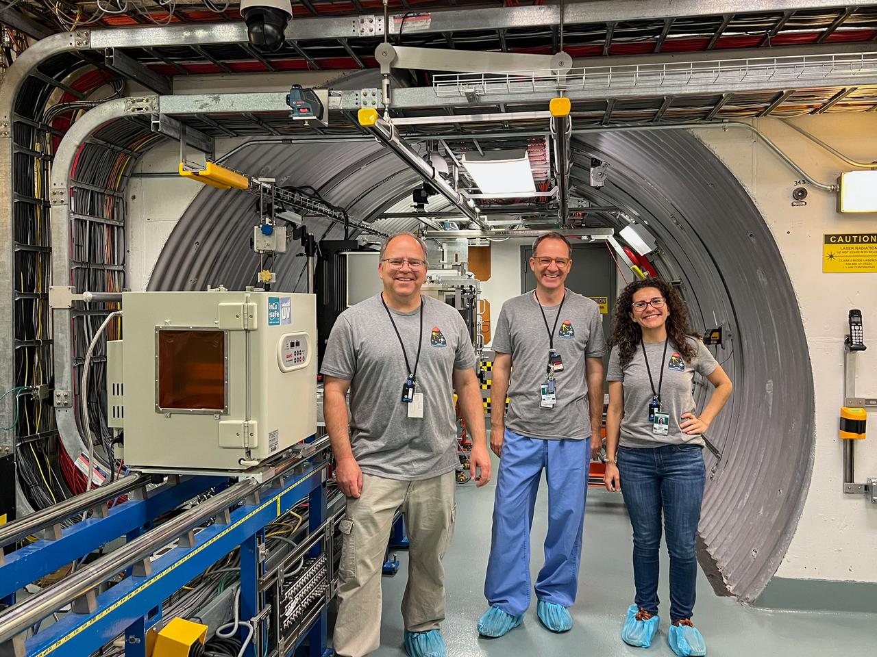 jsc2024e043733 (5/23/2023) --- Members of the Megakaryocyte Flying-One (MeF1) team at the NASA Space Radiation Laboratory at Brookhaven National Laboratory. From left to right: Neal Tolley, Hansjorg Schwertz, and Marina Tristao. This study investigates how environmental conditions affect development and function of platelets and megakaryocytes, cells found in bone marrow. Results could clarify the risks of changes in inflammation, immune responses, and clot formation in spaceflight and on the ground. Image courtesy of the NASA Space Radiation Laboratory.