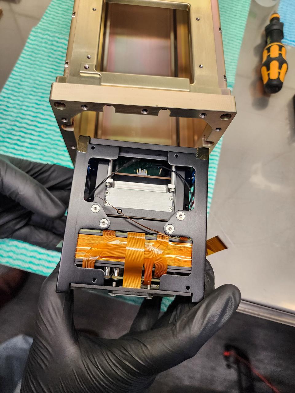 jsc2024e043918 (4/10/2024) ---Binar-2 undergoes deployer fit check testing to ensure all three satellites will be fit for payload integration...Image Credit: Binar Space Program.