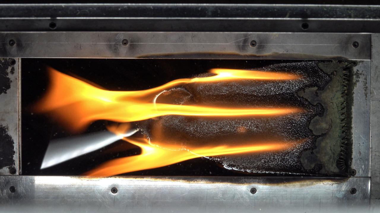 jsc2024e044216 (7/10/2024) --- Top view of spreading flame in ground-based test for the Solid Fuel Ignition and Extinction - Oscillatory Flow on Flame Spread (SoFIE-OFFS) investigation. SoFIE-OFFS examines how intermittent or non-steady flame s behavior impacts fire spread on Earth. Image courtesy of Worcester Polytechnic Institute.