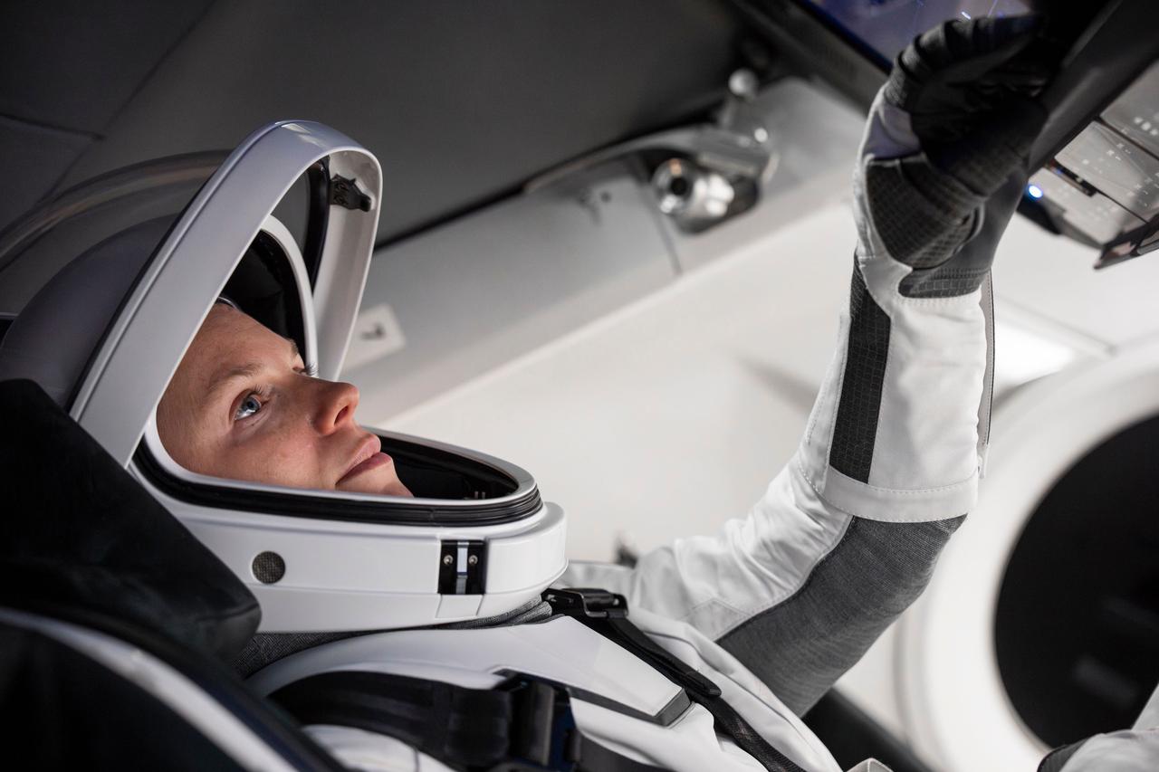 jsc2024e050127 (June 23, 2024) --- NASA’s SpaceX Crew-9 Commander Zena Cardman trains inside a Dragon mockup crew vehicle at SpaceX headquarters in Hawthorne, California. Credit: SpaceX
