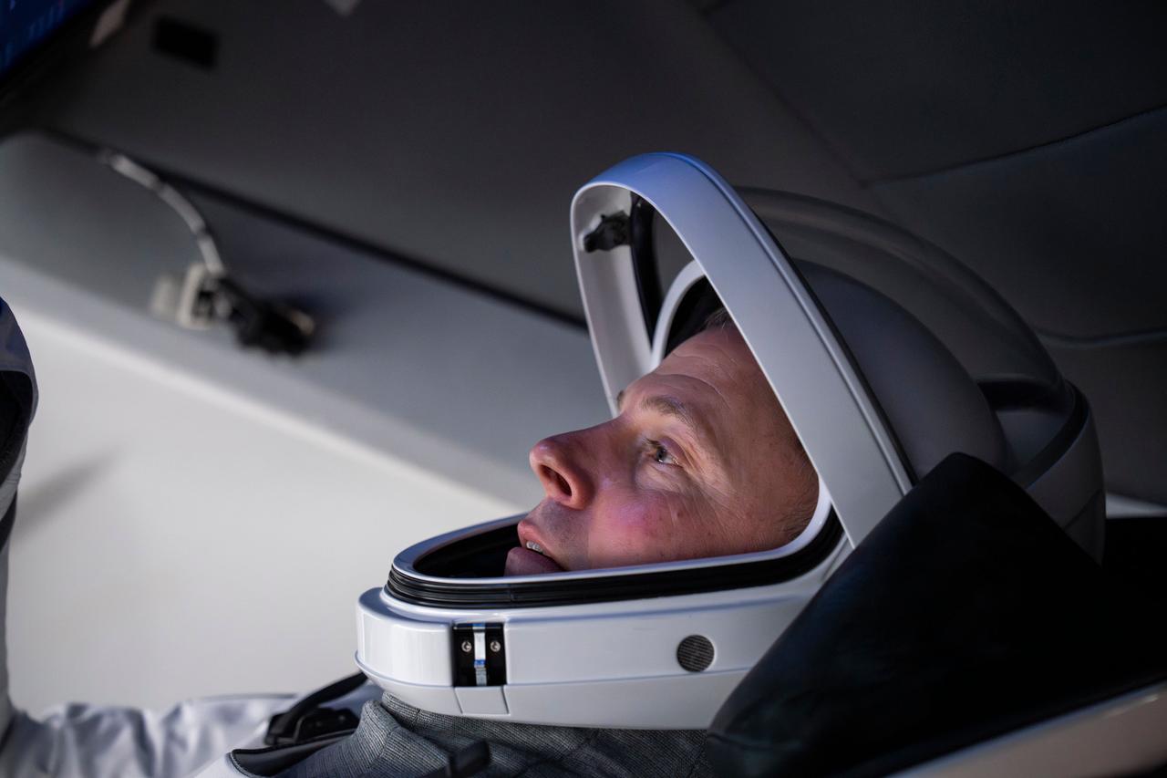 jsc2024e050132 (June 23, 2024) --- NASA’s SpaceX Crew-9 Pilot Nick Hague trains inside a Dragon mockup crew vehicle at the company's headquarters in Hawthorne, California. Credit: SpaceX
