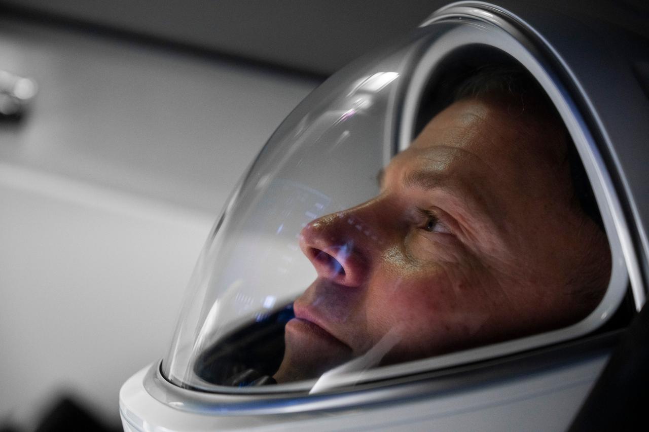 NASA’s SpaceX Crew-9 Pilot Nick Hague is pictured inside a Dragon mockup crew vehicle at SpaceX headquarters in Hawthorne, California. Credit: SpaceX