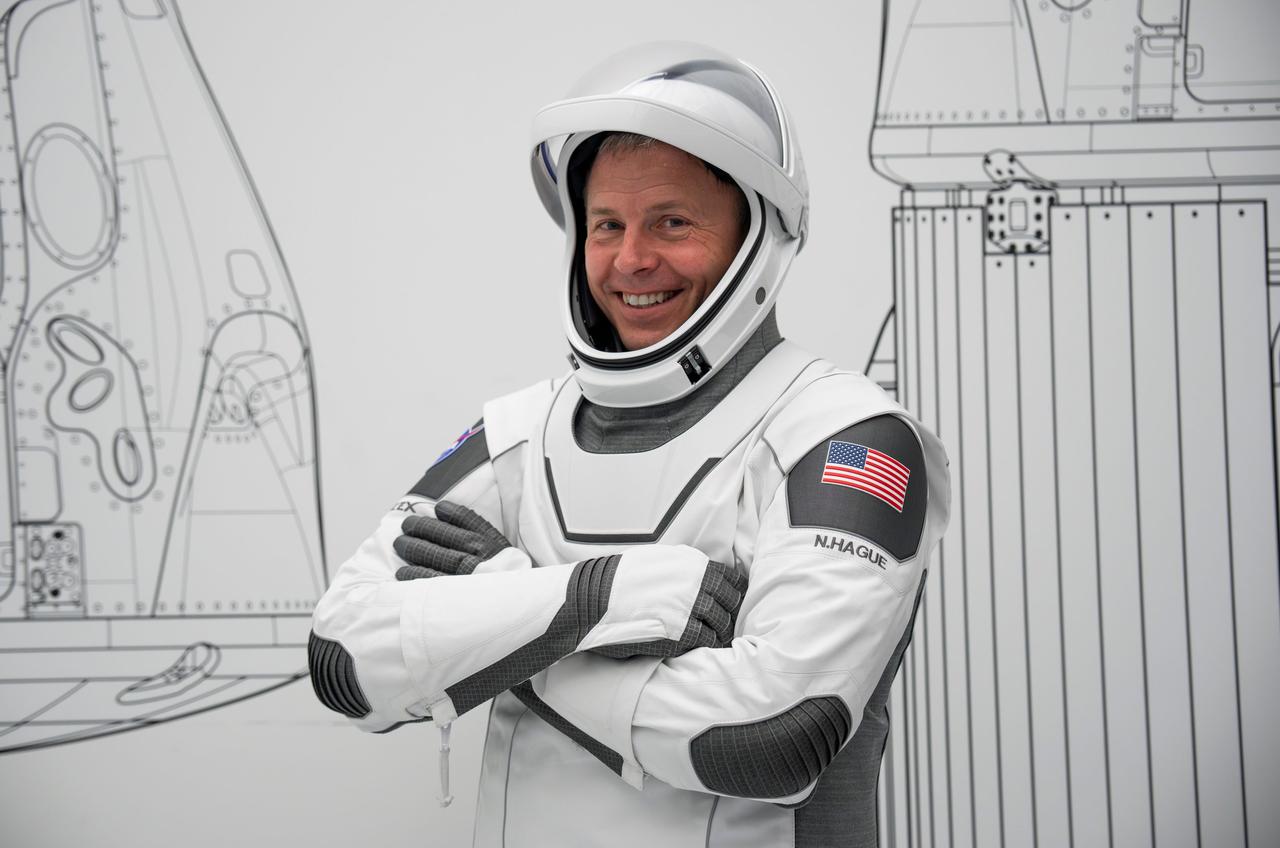 jsc2024e050136 (June 23, 2024) --- NASA’s SpaceX Crew-9 Pilot Nick Hague poses for a photo in his flight suit at SpaceX headquarters in Hawthorne, California. Credit: SpaceX