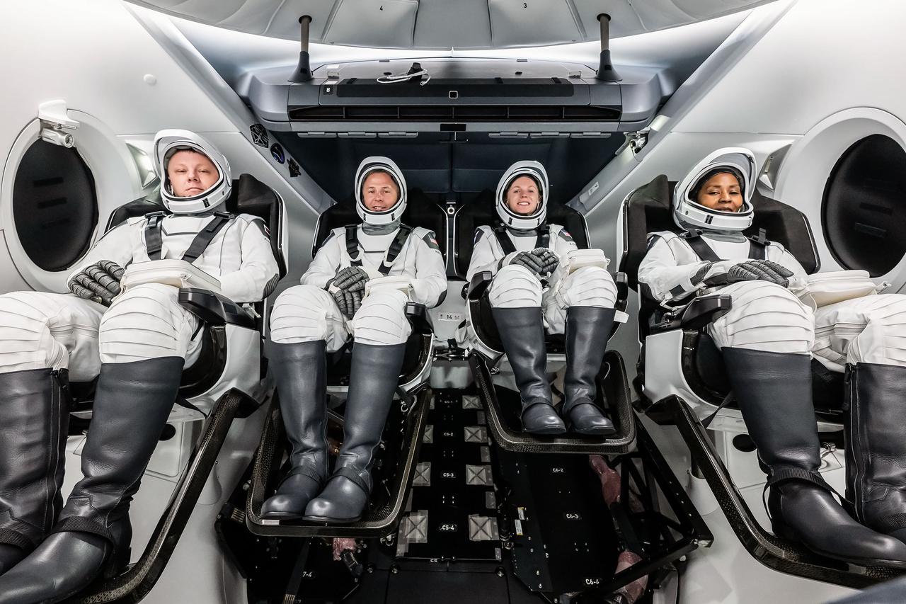 jsc2024e052322 (July 22, 2024) --- The crew of NASA’s SpaceX Crew-9 mission to the International Space Station poses for a photo during a crew equipment interface test (CEIT), which plays an important role in familiarizing crew members with the interior of the Dragon