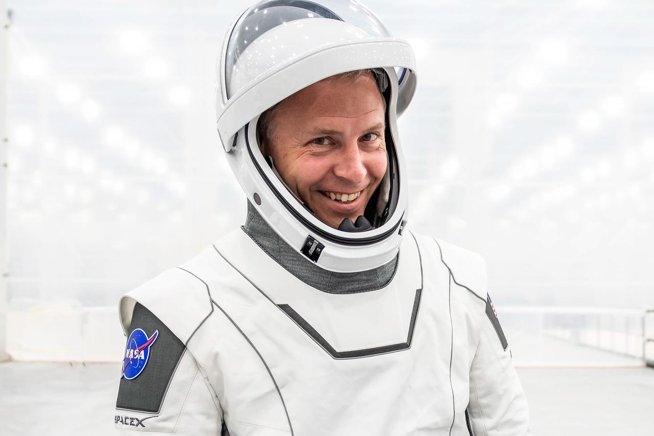 jsc2024e052326 (July 22, 2024) --- NASA’s SpaceX Crew-9 Pilot Nick Hague smiles in his flight suit at SpaceX’s new Dragon refurbishing facility at Kennedy Space Center in Florida. Credit: SpaceX