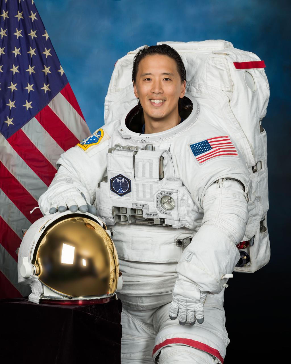 jsc2024e052605_alt (Aug. 6, 2024) --- Official portrait of NASA astronaut Jonny Kim posing in a spacesuit at NASA's Johnson Space Center. Credit: NASA/Josh Valcarcel