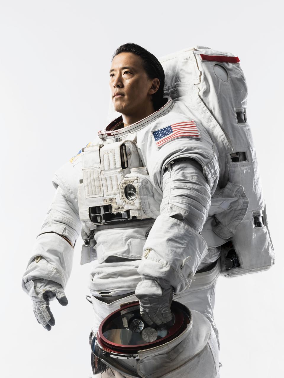 jsc2024e052673_alt (July 17, 2024) --- Portrait of NASA Astronaut Jonny Kim in an Extravehicular Mobility Unit (EMU) spacesuit taken at NASA's Johnson Space Center in Houston, Texas. Credit: NASA/Josh Valcarcel