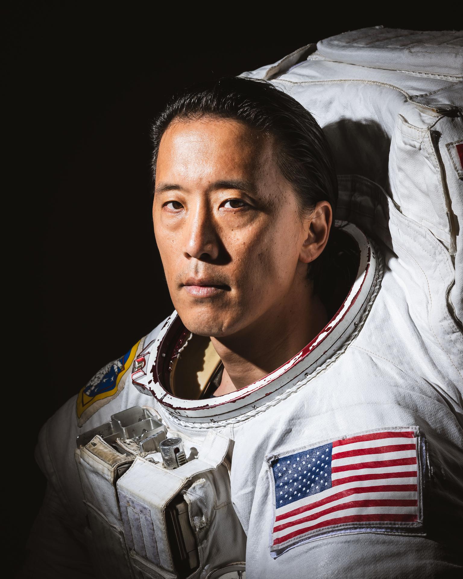Portrait of NASA Astronaut Jonny Kim in an Extravehicular Mobility Unit (EMU) spacesuit taken at NASA's Johnson Space Center in Houston, Texas.