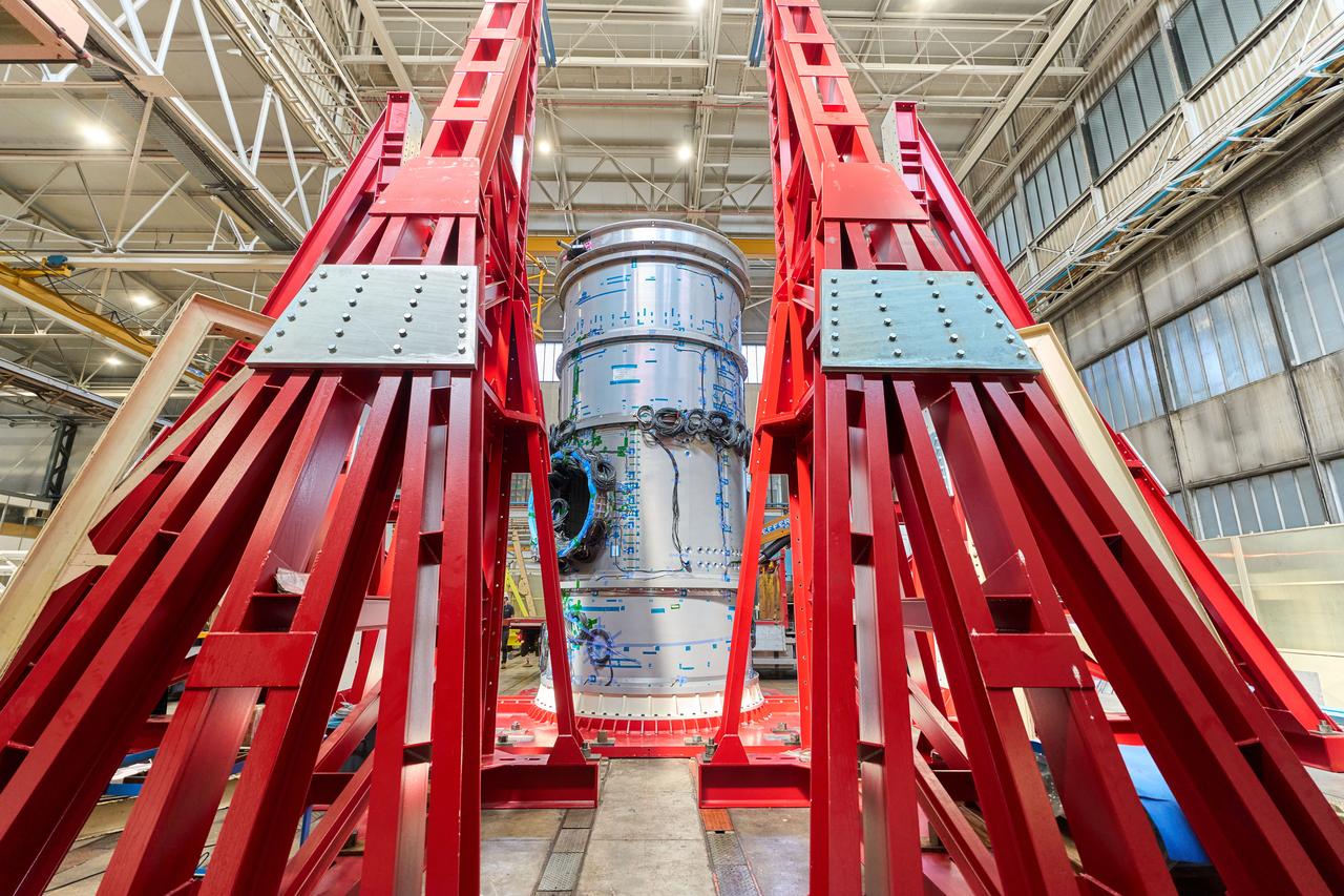jsc2024e055349 (July 9, 2024) -- Gateway’s Habitation and Logistics Outpost stands vertically inside a Thales Alenia Space facility in Turin, Italy, after completing static load testing. With this phase of stress testing complete, the module is one step closer to final outfitting ahead of launch to lunar orbit.