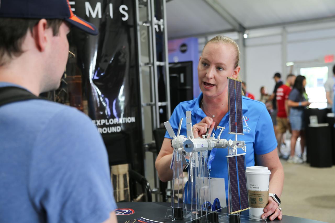  jsc2024e055758 (July 26, 2024) --  Emma Lehnhardt, Gateway Program Planning and Control Manager, shares the wonders of Gateway with event attendees during EAA AirVenture Oshkosh 2024. Photo Credit: NASA/Andrew Carlsen  
