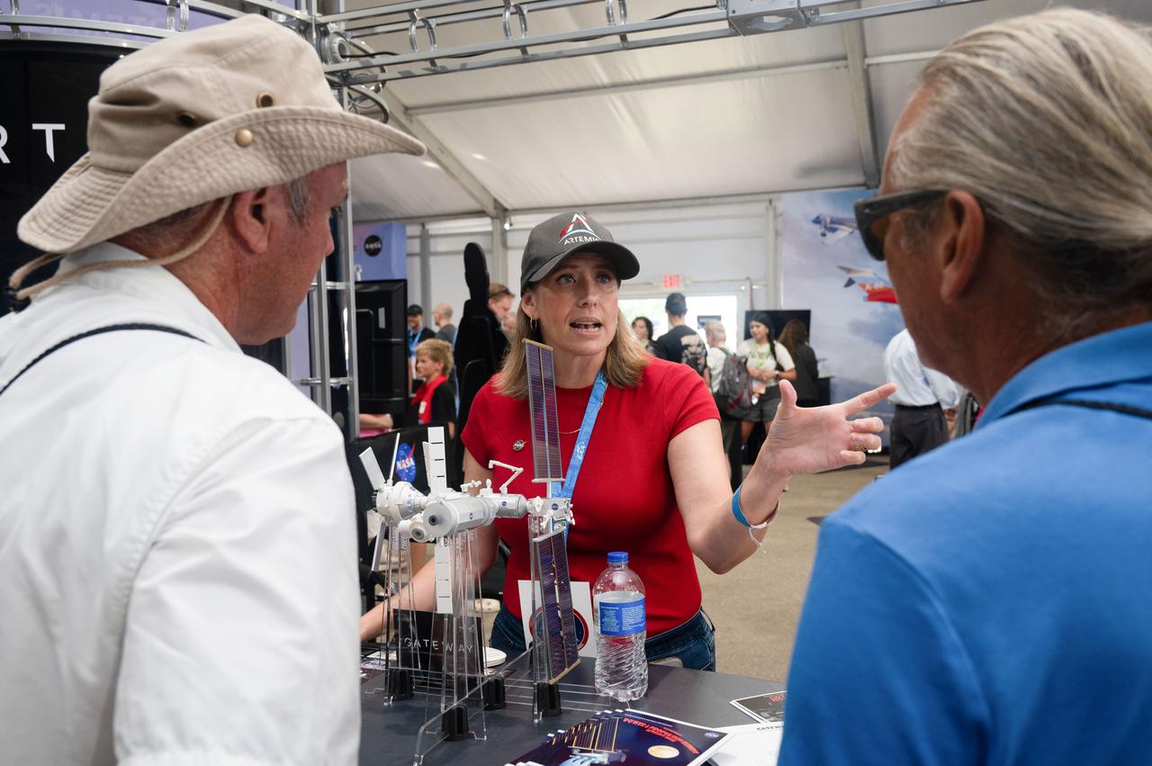 jsc2024e055760 (July 26, 2024) --  Tiffany Travis, Strategic Communications Manager with the Gateway Program, shares the marvels of Gateway with event attendees during EAA AirVenture Oshkosh 2024. Photo Credit: NASA/Andrew Carlsen  