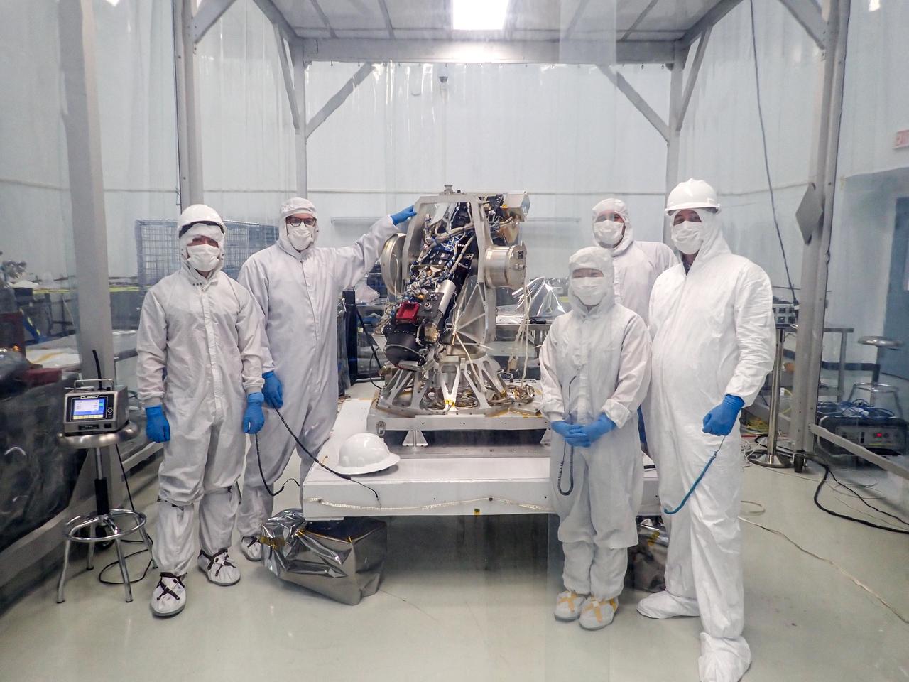 jsc2024e061939 (5/2/2023) --- Team members pose with the COronal Diagnostic EXperiment (CODEX) instrument in a clean facility during initial integration of the coronagraph with the pointing system. Credit: CODEX team / NASA