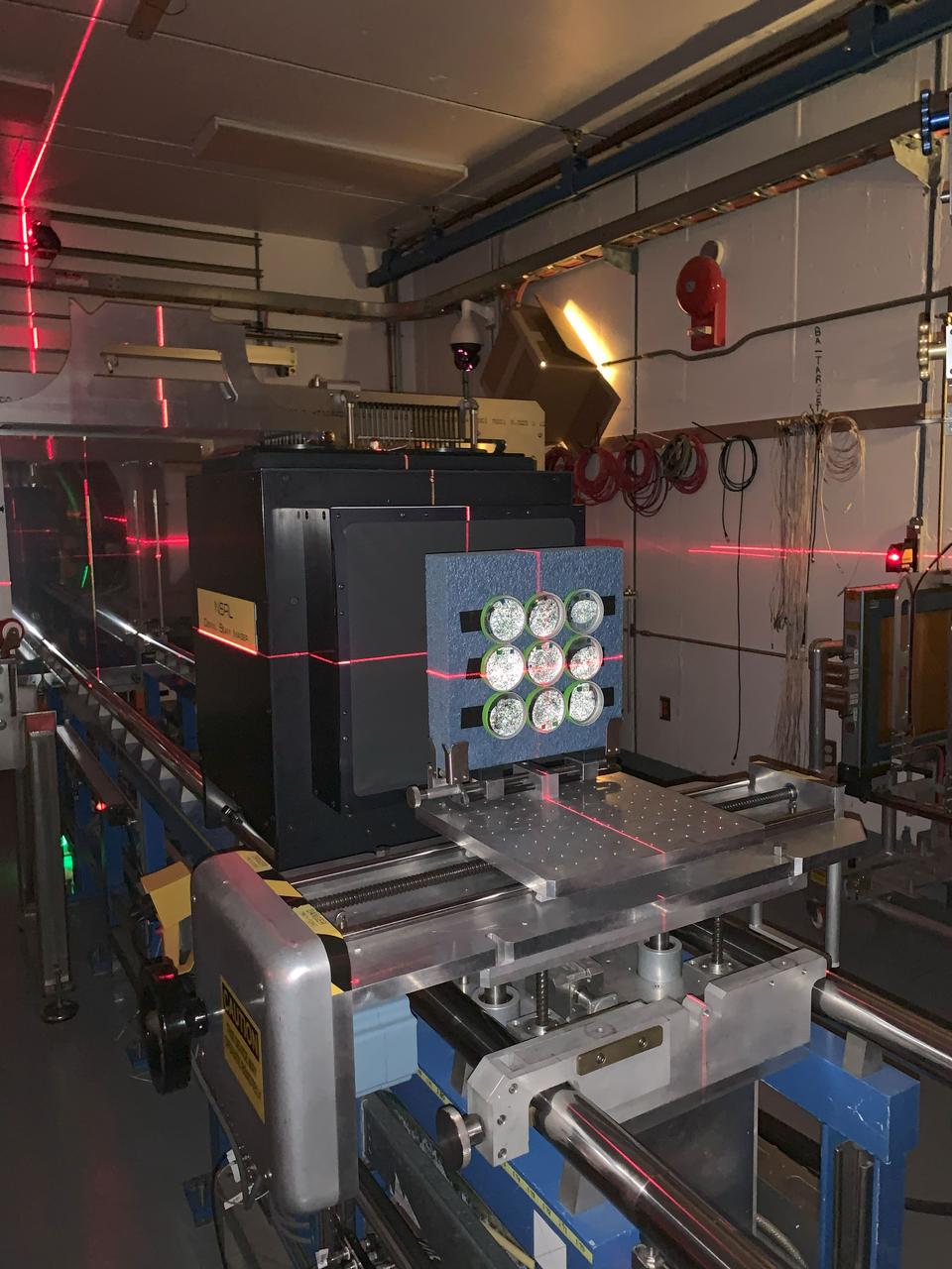 jsc2024e062109 (9/13/2024) ---The ANT1 Radiation Tolerance Experiment with Moss in Orbit on the Space Station (ARTEMOSS) plates are attached to the foam holder prepared for the ion beam run in the target room at the NASA Space Radiation Laboratory (NSRL), at the Brookhaven National Laboratory (BNL), with a visible laser used to center the beam placement. The ARTEMOSS investigation examines whether and how an Antarctic moss repairs damage caused by cosmic radiation and microgravity. Image courtesy of Agata Zupanska.