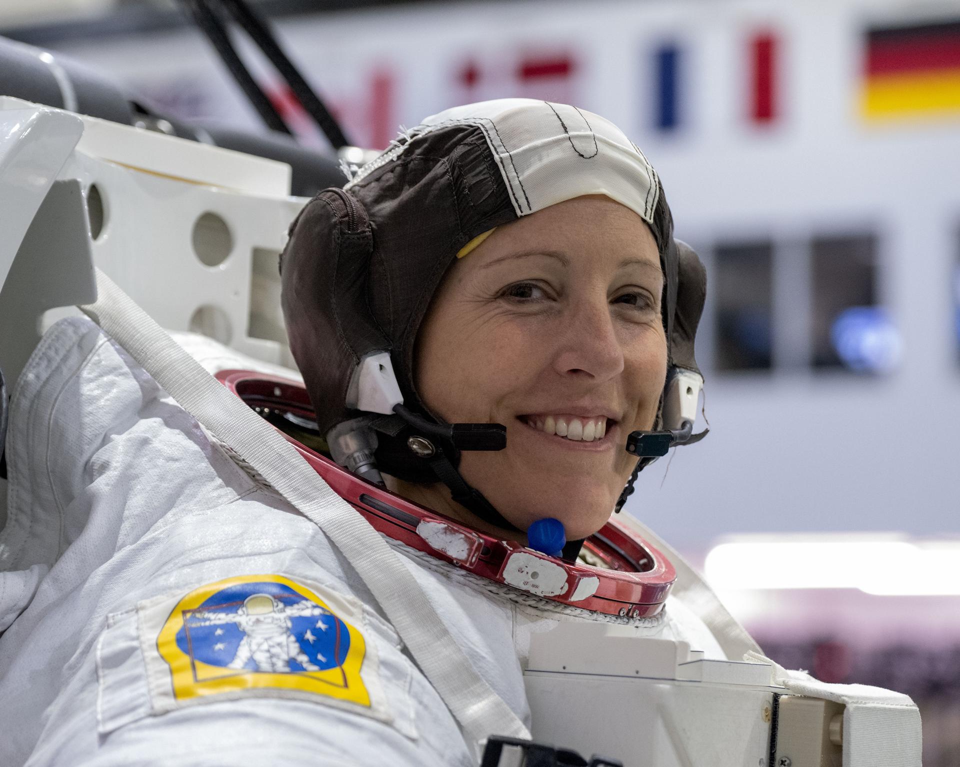 ESA (European Space Agency) astronaut Sophie Adenot smiles for a portrait as she gets suited up for a spacewalk training session at Johnson Space Center's Neutral Buoyancy Laboratory in Houston, Texas.