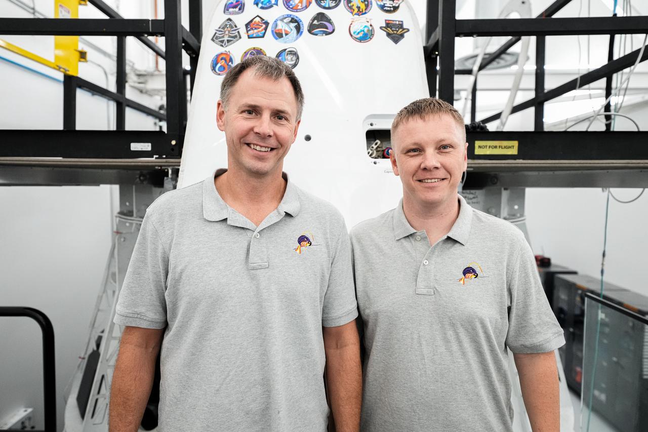 jsc2024e062797 (Jan. 14, 2024) --- NASA's SpaceX Crew-9 crew members Nick Hague and cosmonaut Aleksandr Gorbunov smile for a photo ahead of their launch to the International Space Station. Credit: SpaceX