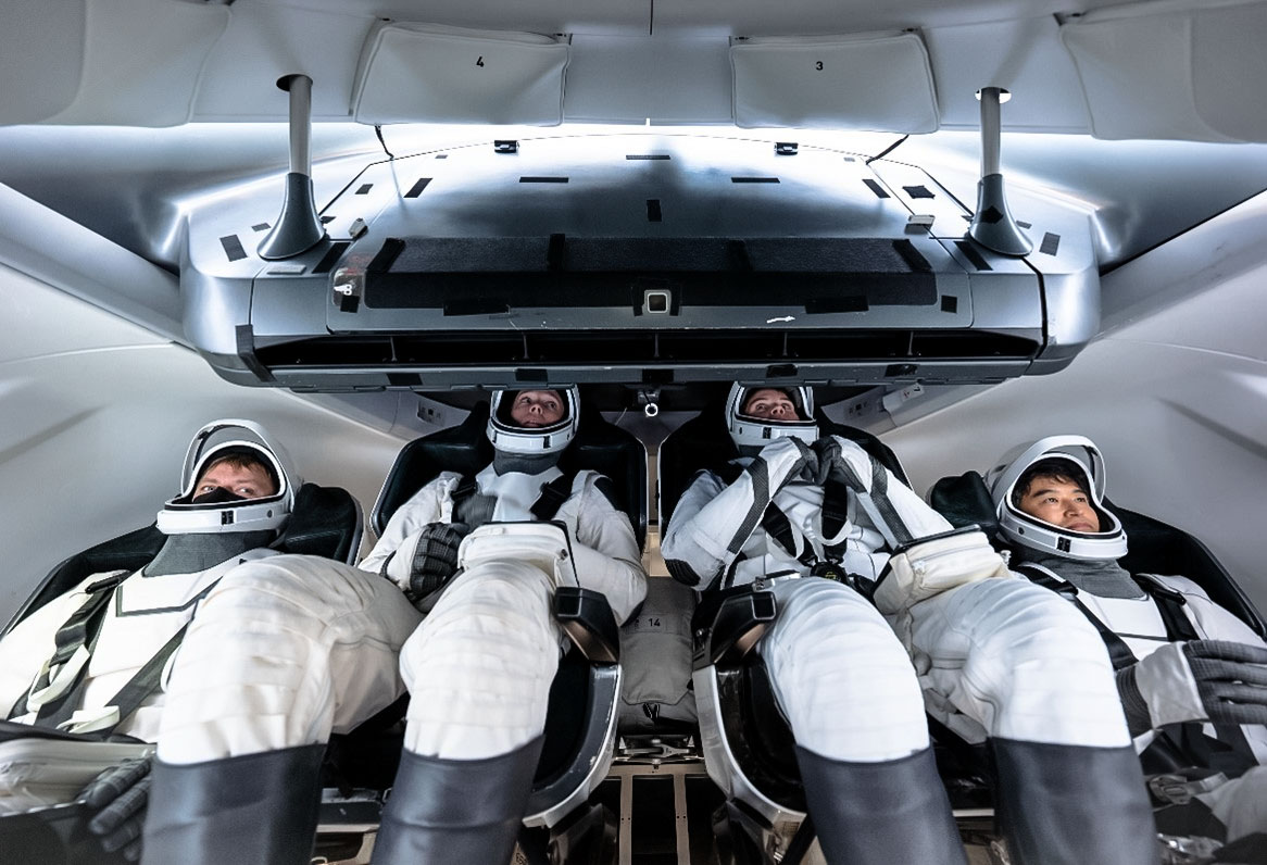 jsc2024e064438 (Sept. 30, 2024) --- Crew-10 mission (from left) Mission Specialist Kirill Peskov of Roscosmos, NASA astronauts Nichole Ayers, pilot, and Anne McClain, commander, along with Mission Specialist Takuya Onishi of JAXA (Japan Aerospace Exploration Agency) are pictured training inside a Dragon mockup crew vehicle at SpaceX in Hawthorne, California. Credit: SpaceX