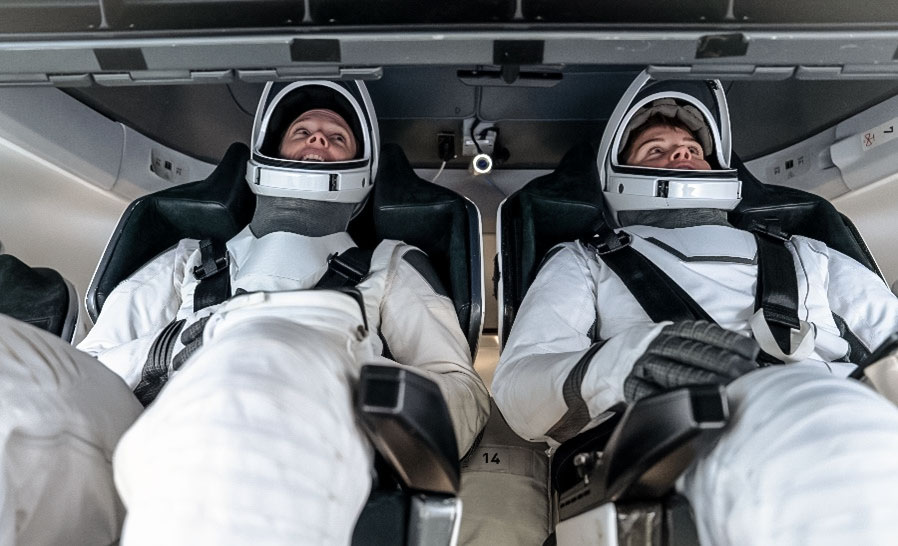 NASA astronauts (from left) Nichole Ayers and Anne McClain, Crew-10 pilot and commander respectively, participate in preflight mission training inside a Dragon mockup crew vehicle at SpaceX in Hawthorne, California. Credit: SpaceX