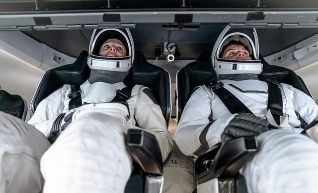 jsc2024e064439 (Sept. 30, 2024) --- NASA astronauts (from left) Nichole Ayers and Anne McClain, Crew-10 pilot and commander respectively, participate in preflight mission training inside a Dragon mockup crew vehicle at SpaceX in Hawthorne, California. Credit: SpaceX