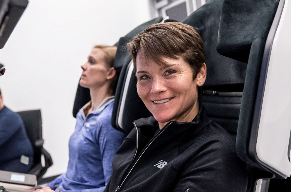 NASA astronaut and commander of NASA’s SpaceX Crew-10 mission Anne McClain smiles during training inside a mockup of a Dragon cockpit at the company's facilities in Hawthorne, California. Credit: SpaceX