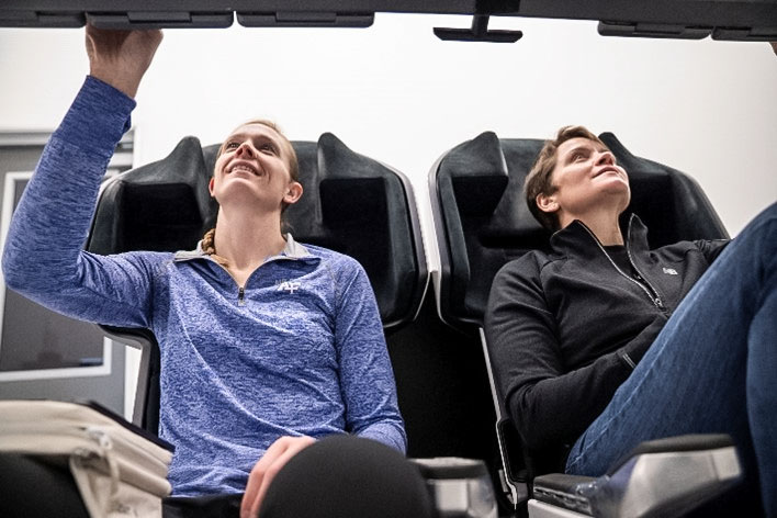 NASA astronauts (from left) Nichole Ayers and Anne McClain, NASA’s SpaceX Crew-10 mission pilot and commander respectively, train inside a mockup of a Dragon cockpit at the company's facilities in Hawthorne, California. Credit: SpaceX