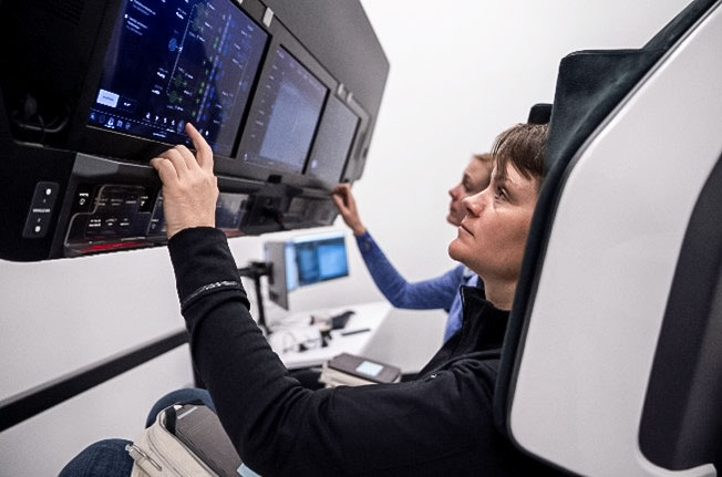 NASA astronaut and commander of NASA’s SpaceX Crew-10 mission Anne McClain trains inside a mockup of a Dragon cockpit at the company's facilities in Hawthorne, California. Credit: SpaceX