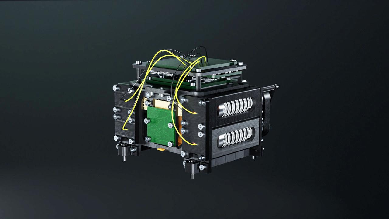 jsc2024e065167 (10/3/2024) --- Render of the Nanolab Astrobeat module core. This investigation tests cold welding in a space environment. Cold welding is a method in which metallic materials fuse or weld at ambient temperature provided that there is sufficient high contact force. Testing consists of releasing tension in springs so two pieces of metal collide to perform cold welding. Image courtesy of Dr. Leonardo Barilaro, The Malta College of Arts, Science & Technology.