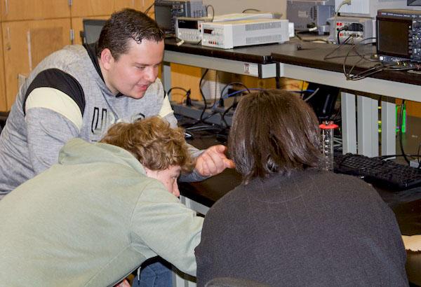 jsc2024e066523 (1/6/2024) --- Colorado Springs students Noah Grebe, Luke Davis, and Blake MacDonald observe crystal growth.Their experiment, Calcium Sulfate Crystal Growth in Microgravity, is part of the Nanoracks-National Center for Earth and Space Science Education-Surveyor-Student Spaceflight Experiments Program Mission 18 to ISS (Nanoracks-NCESSE-Surveyor-SSEP).