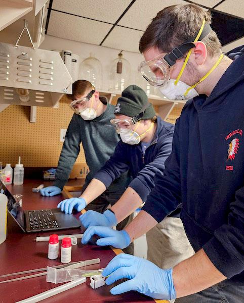 jsc2024e066535 (1/31/2024) --- The University of North Dakota Space Beans Crew looks over their data during the first run of their experiment, The Effects of 6-Benzylaminopurine Enriched Soil on the Growth of Phaseolus vulgaris (Black Beans) in Microgravity. Their experiment is part of the Nanoracks-National Center for Earth and Space Science Education-Surveyor-Student Spaceflight Experiments Program Mission 18 to ISS (Nanoracks-NCESSE-Surveyor-SSEP).