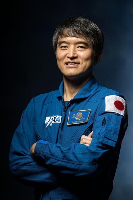 JAXA astronaut Takuya Onishi poses for a crew portrait