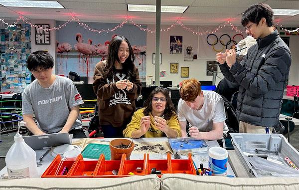 jsc2024e067098 (10/15/2024) --- James Martin High School students Kaleb Kim, Camilo Henao, Grant Hester, Ethan Chen and Sophia Lin Ochoa streamline germination parameters for their experiment, Germination of Pisum sativum in Microgravity. Their experimen is part of the Nanoracks-National Center for Earth and Space Science Education-Surveyor-Student Spaceflight Experiments Program Mission 18 to ISS (Nanoracks-NCESSE-Surveyor-SSEP).