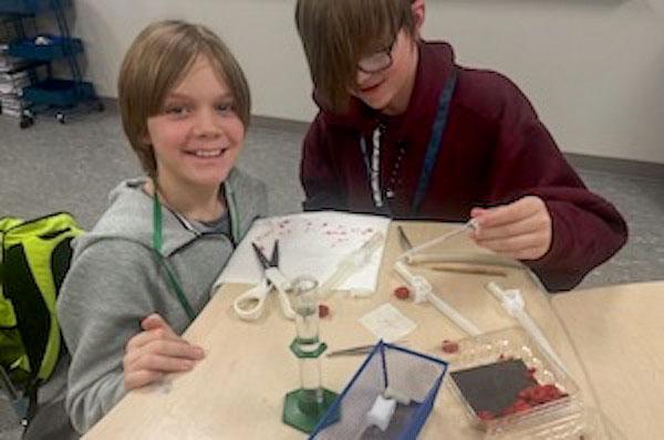 jsc2024e067099 (10/15/2024) --- Stream Middle School students Cade Sando and Mac McGinnis harvest raspberry seeds to complete additional raspberry seed growth trials to optimize and finalize their experiment, Growth of Raspberry Seeds in Microgravity. Their experiment is part of the Nanoracks-National Center for Earth and Space Science Education-Surveyor-Student Spaceflight Experiments Program Mission 18 to ISS (Nanoracks-NCESSE-Surveyor-SSEP).