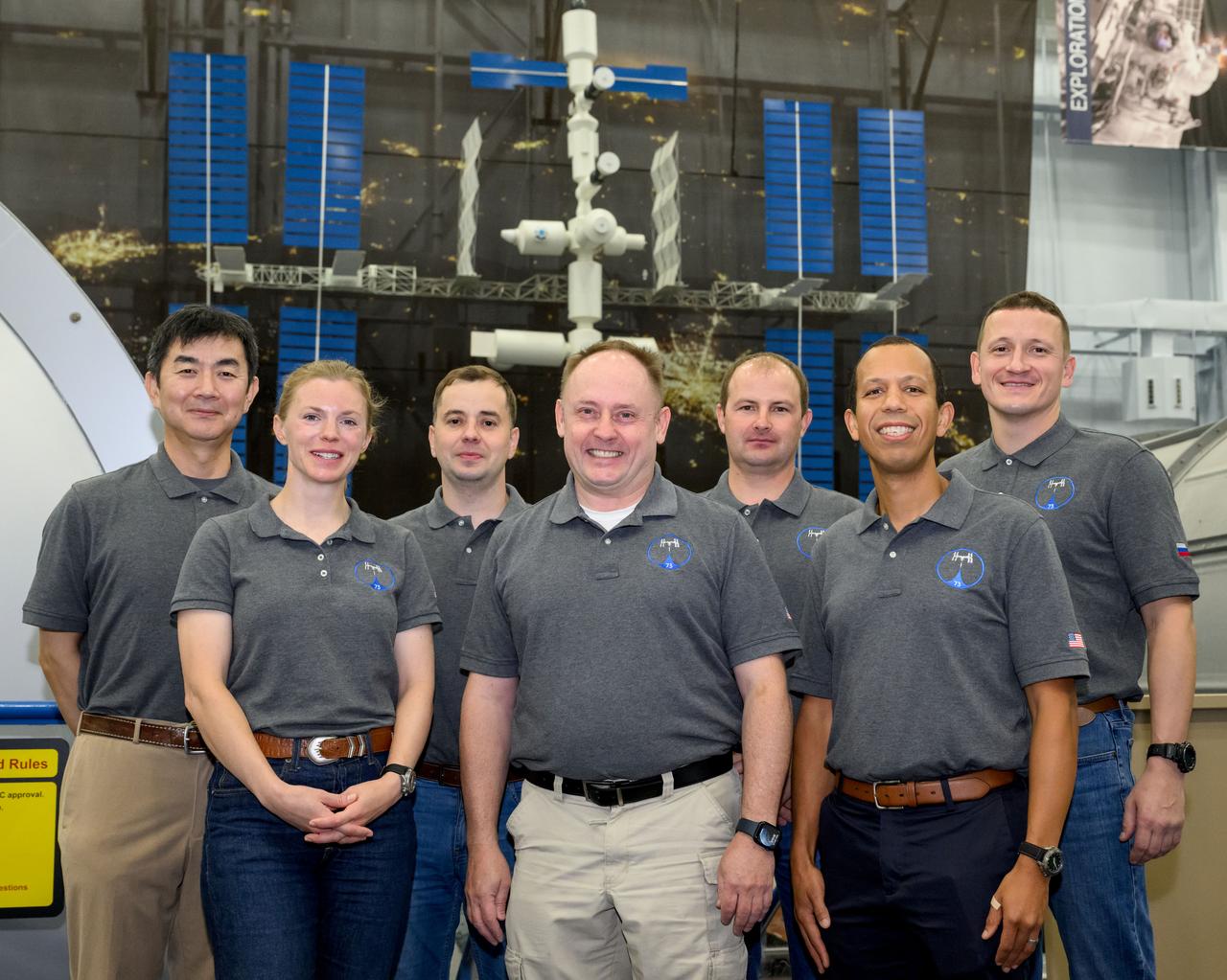 jsc2024e074729 (Nov. 13, 2024) --- The crew members of the International Space Station’s Expedition 74 crew pose for a group photo after a training session at the Space Vehicle Mockup Facility at NASA’s Johnson Space Center in Houston, Texas. Back row from left, Kimiya Yui, Oleg Platonov, Sergei Mikaev, and Sergey Kud-Sverchkov. Front row from left: Zena Cardman, Mike Fincke, and Chris Williams. 