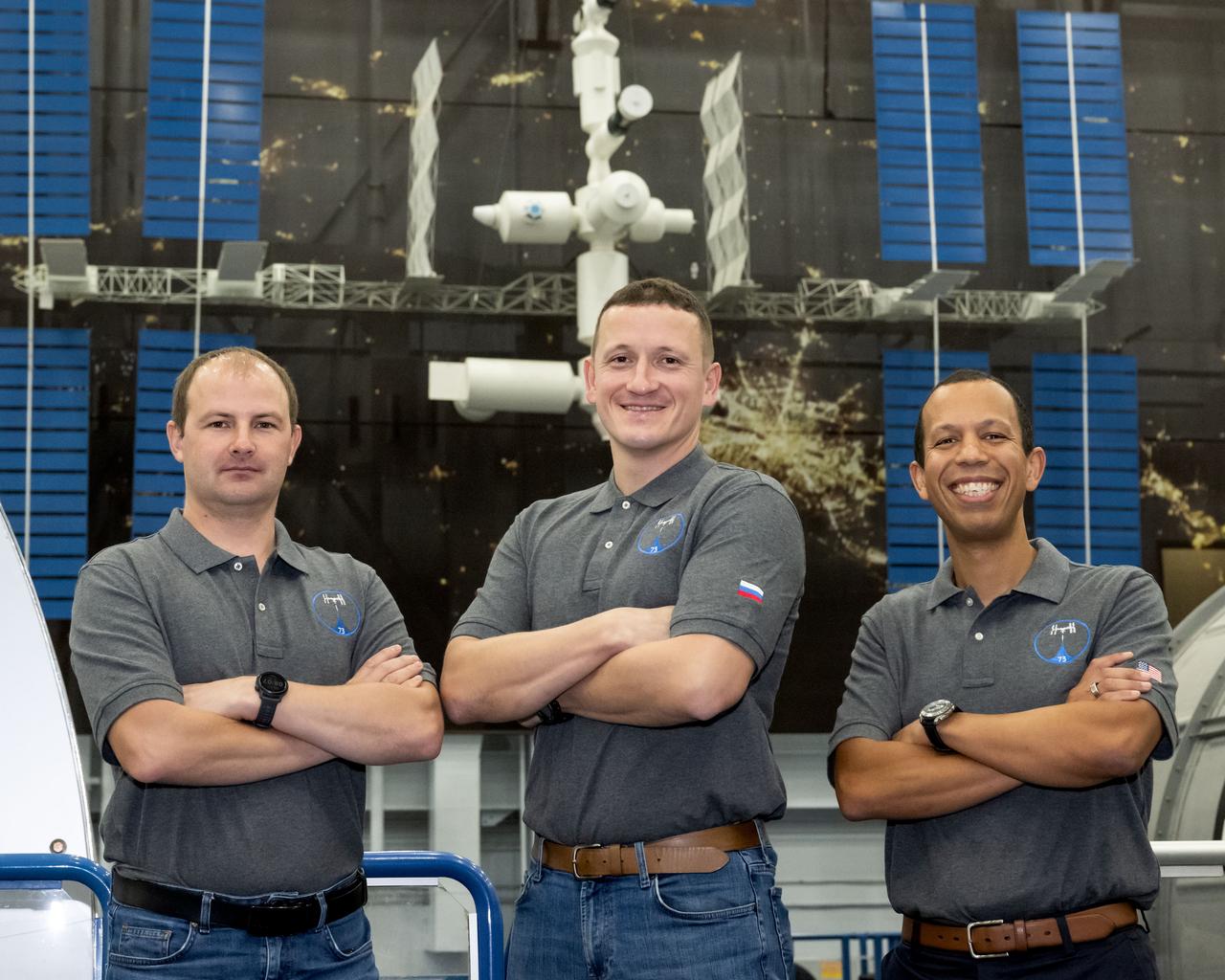 jsc2024e074733 (Nov. 13, 2025) --- The crew members launching aboard the Soyuz MS-28 spacecraft in November pose for a photo after a training session at the Space Vehicle Mockup Facility at NASA’s Johnson Space Center in Houston, Texas. The trio will launch to the International Space Station and join Expedition 74. From left: Roscosmos cosmonauts Sergei Mikaev and Sergey Kud-Sverchkov, and NASA astronaut Chris Williams. 