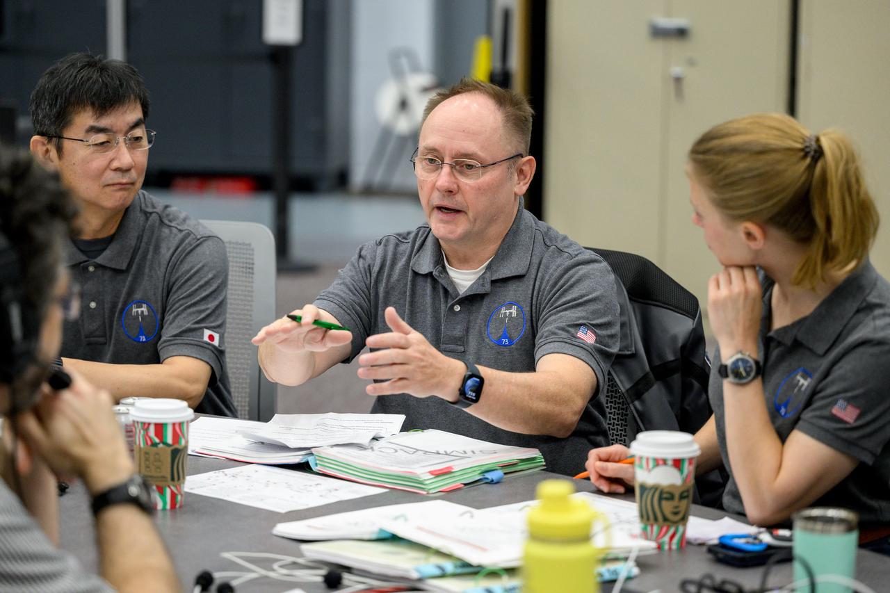 jsc2024e074736 (Nov. 13, 2024) --- From left to right: JAXA astronaut Kimiya Yui, NASA astronaut Mike Fincke, and NASA astronaut Zena Cardman conduct training for the unlikely event of an emergency at the Space Vehicle Mockup Facility at NASA’s Johnson Space Center in Houston, Texas. Credit: NASA/Josh Valcarcel