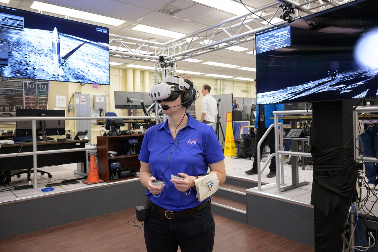 jsc2024e076628 – Tess Caswell, a crew stand-in for the Artemis III Virtual Reality Mini-Simulation, executes a moonwalk in the Prototype Immersive Technology (PIT) lab at NASA’s Johnson Space Center in Houston. The simulation was a test of using VR as a training method for flight controllers and science teams’ collaboration on science-focused traverses on the lunar surface. Credit: NASA/Robert Markowitz