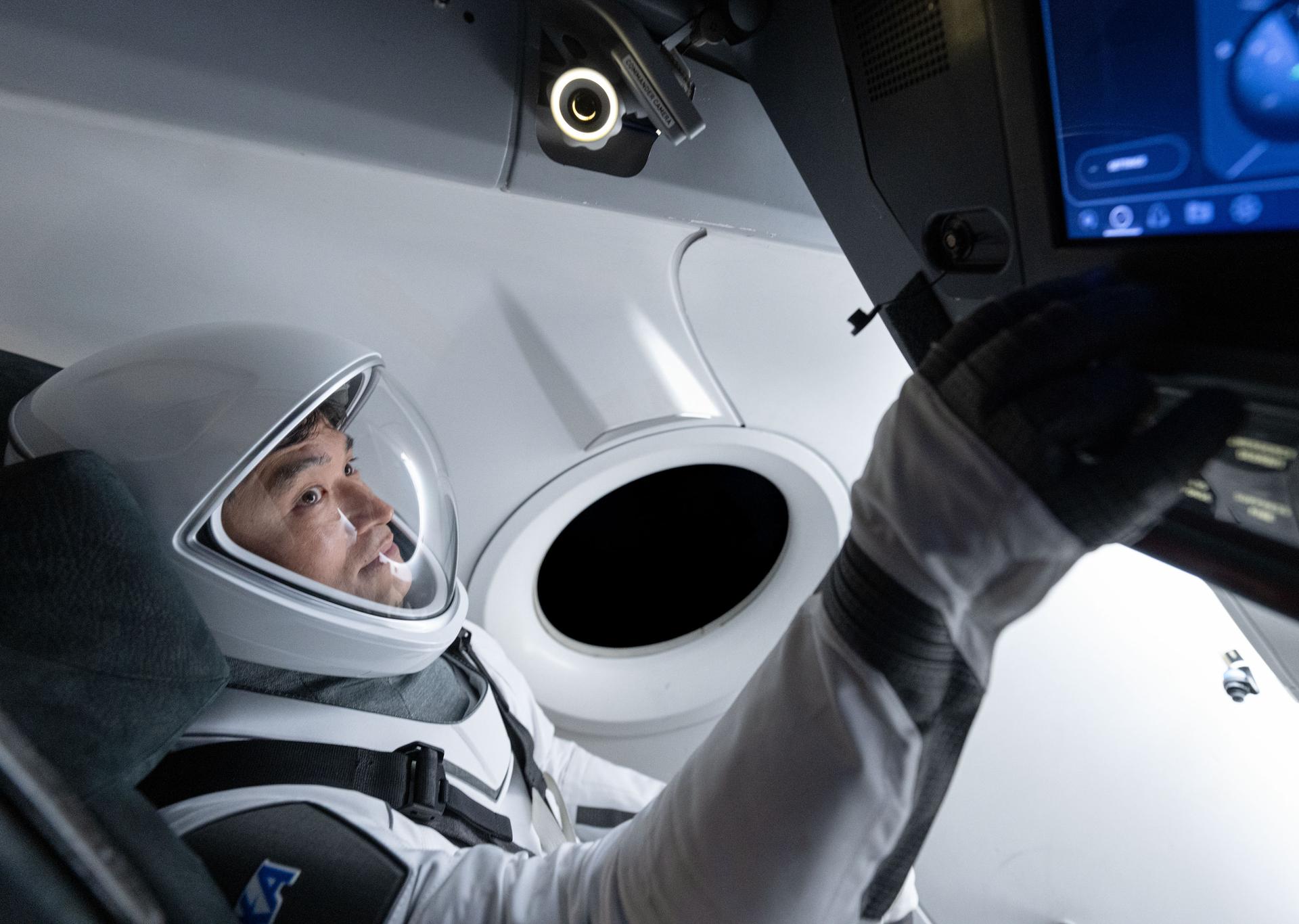 NASA’s SpaceX Crew-10 Mission Specialist Takuya Onishi of JAXA (Japan Aerospace Exploration Agency) is pictured training inside a mockup of a Dragon cockpit at the company's facilities in Hawthorne, California.