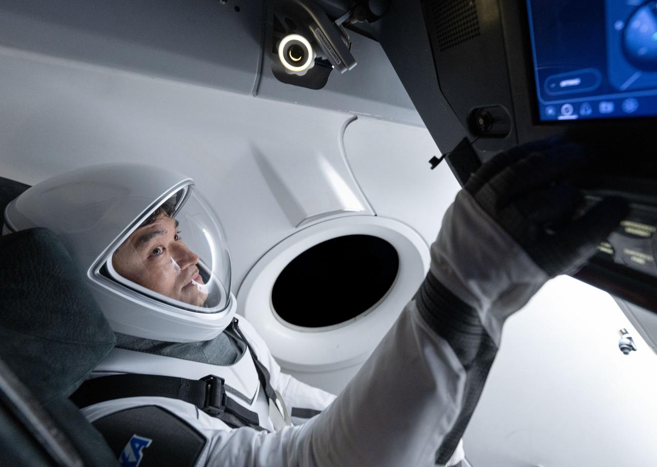jsc2024e079793 (Nov. 20, 2024) --- NASA’s SpaceX Crew-10 Mission Specialist Takuya Onishi of JAXA (Japan Aerospace Exploration Agency) is pictured training inside a mockup of a Dragon cockpit at the company's facilities in Hawthorne, California. Credit: SpaceX