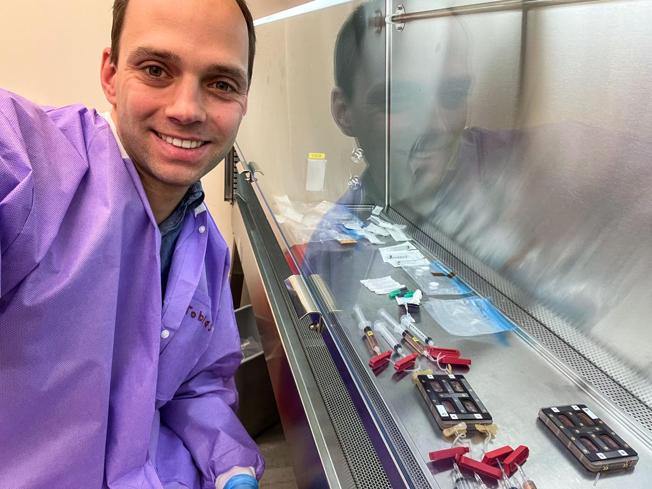 Dr. Tobias Niederwieser simulating crew operations of the biomanufacturing process during the Experiment Verification Test (EVT). (Credit: BioServe)