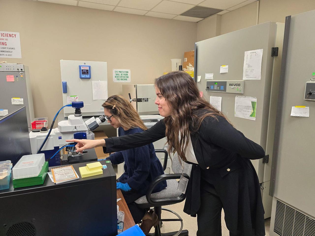 jsc2025e007252 (2/14/2025) --- Dr. Yo-Ann Velez performs microscopy in support of Polaris Bioremediation Science Experiment - Genetic Exchange in Microgravity for Biofilm Bioremediation (GEM-B2). 