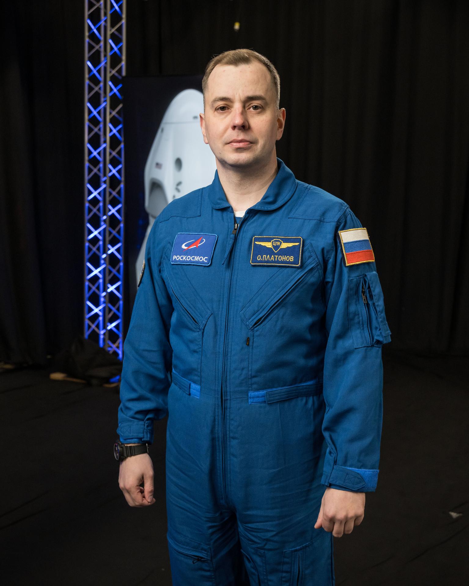 Roscosmos cosmonaut Oleg Platonov poses for a photo during an interview in a studio at NASA’s Johnson Space Center in Houston, Texas, before his upcoming mission to the International Space Station.