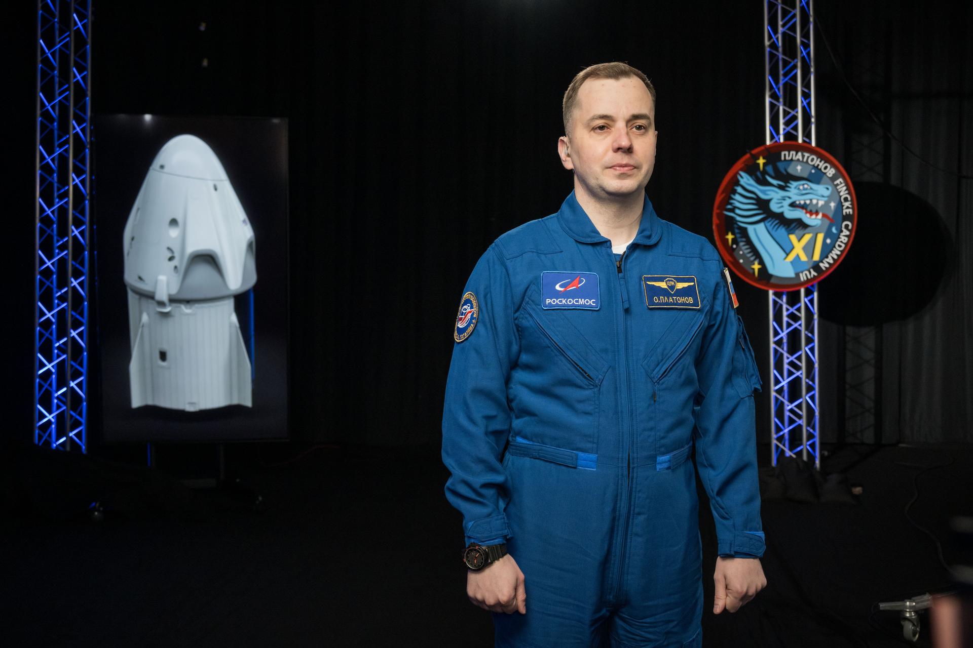Roscosmos cosmonaut Oleg Platonov poses for a photo during an interview in a studio at NASA’s Johnson Space Center in Houston, Texas, before his upcoming mission to the International Space Station. Credit: NASA/Robert Markowitz