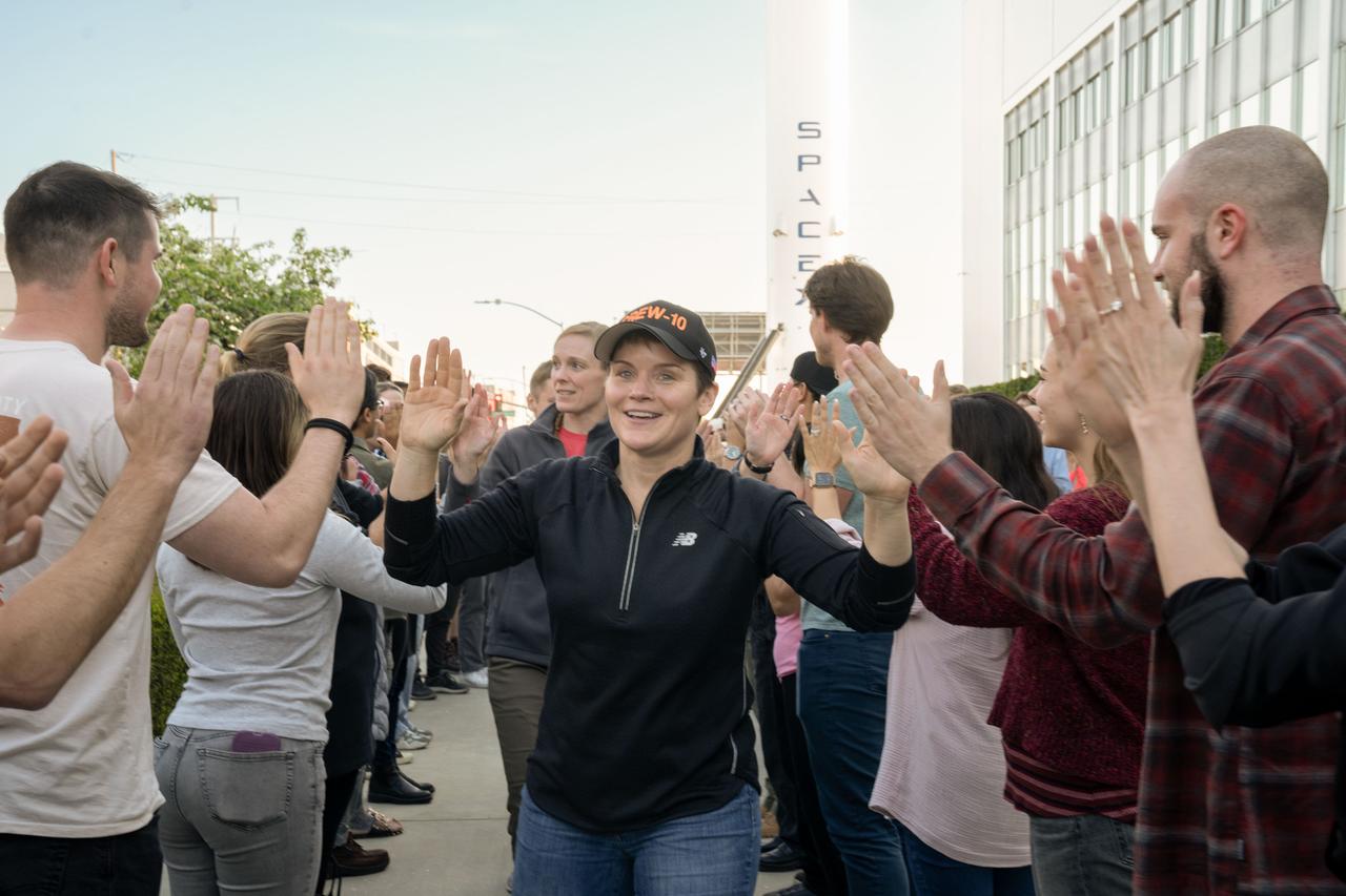 NASA astronaut and commander of NASA's SpaceX Crew-10 mission Anne McClain smiles and high fives SpaceX employees during a sendoff at the company’s facility in Hawthorne, California. Credit: SpaceX