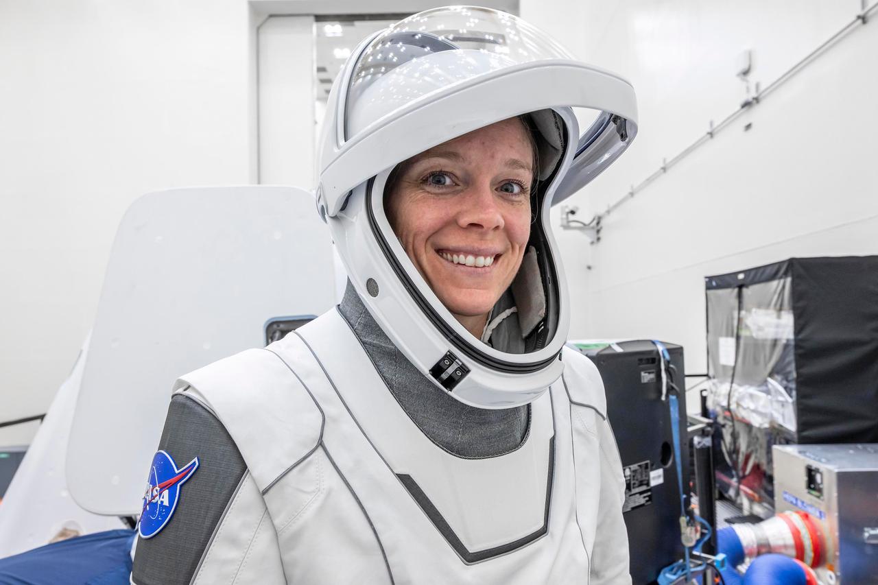 jsc2025e012272 - (February 17, 2025) --- NASA’s SpaceX Crew-10 Pilot Nichole Ayers smiles in her flight suit at NASA's Kennedy Space Center in Florida.